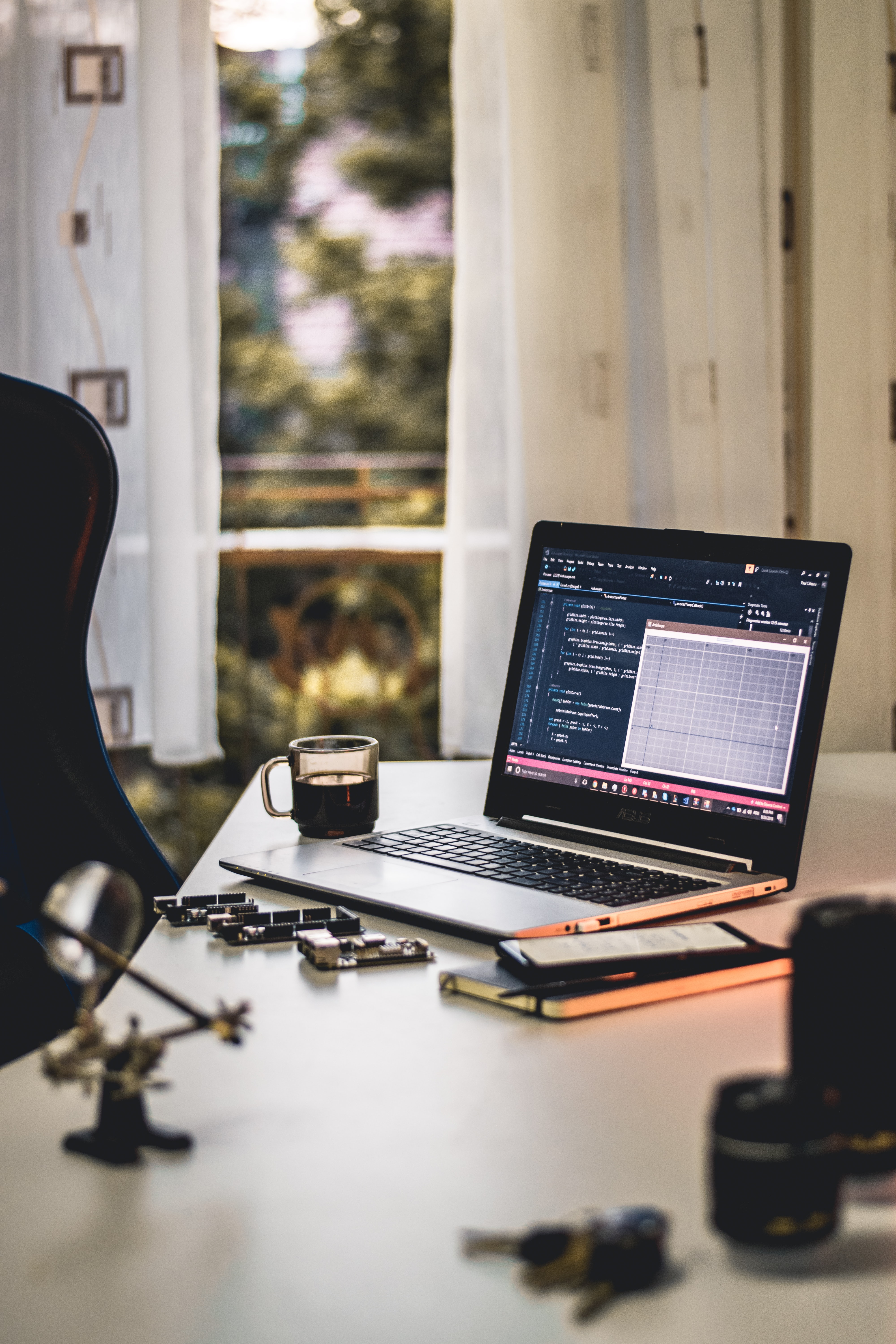 A table with laptop and electronic IoT boards