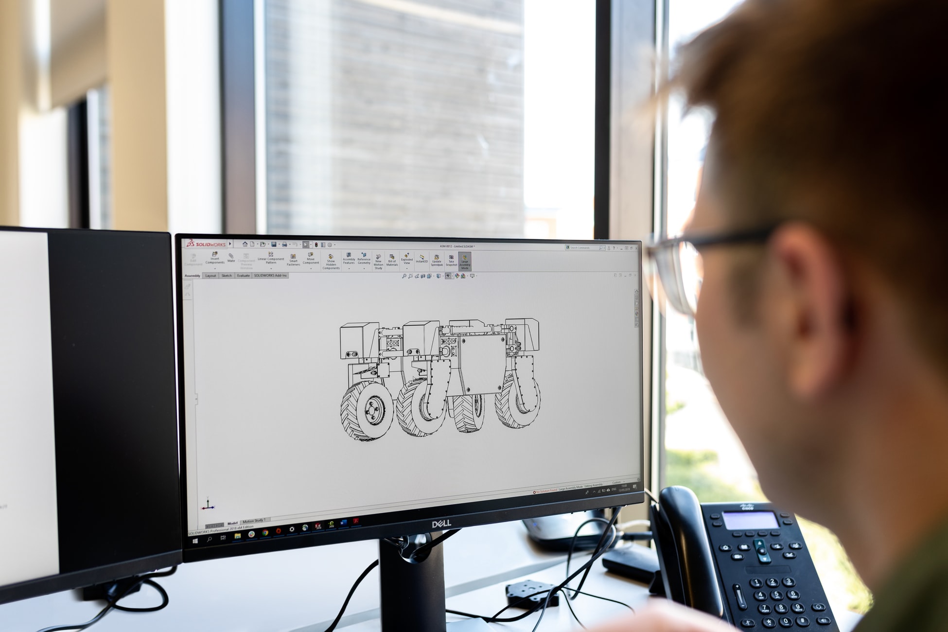 A person working on CAD software